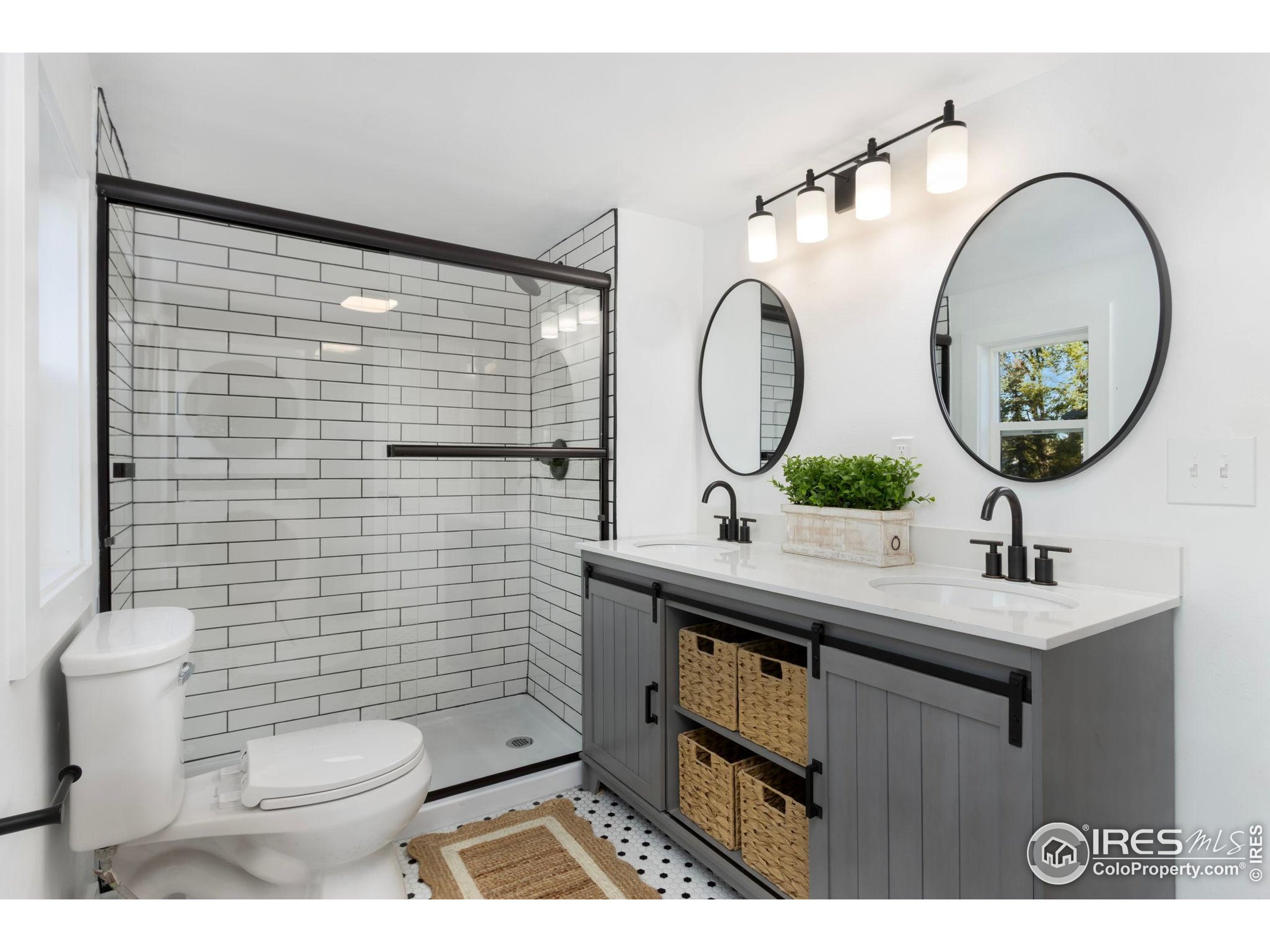 437 Clover Lane Fort Collins, CO 80521 - Photo 9 of 22 a bathroom with a toilet a sink and a mirror
