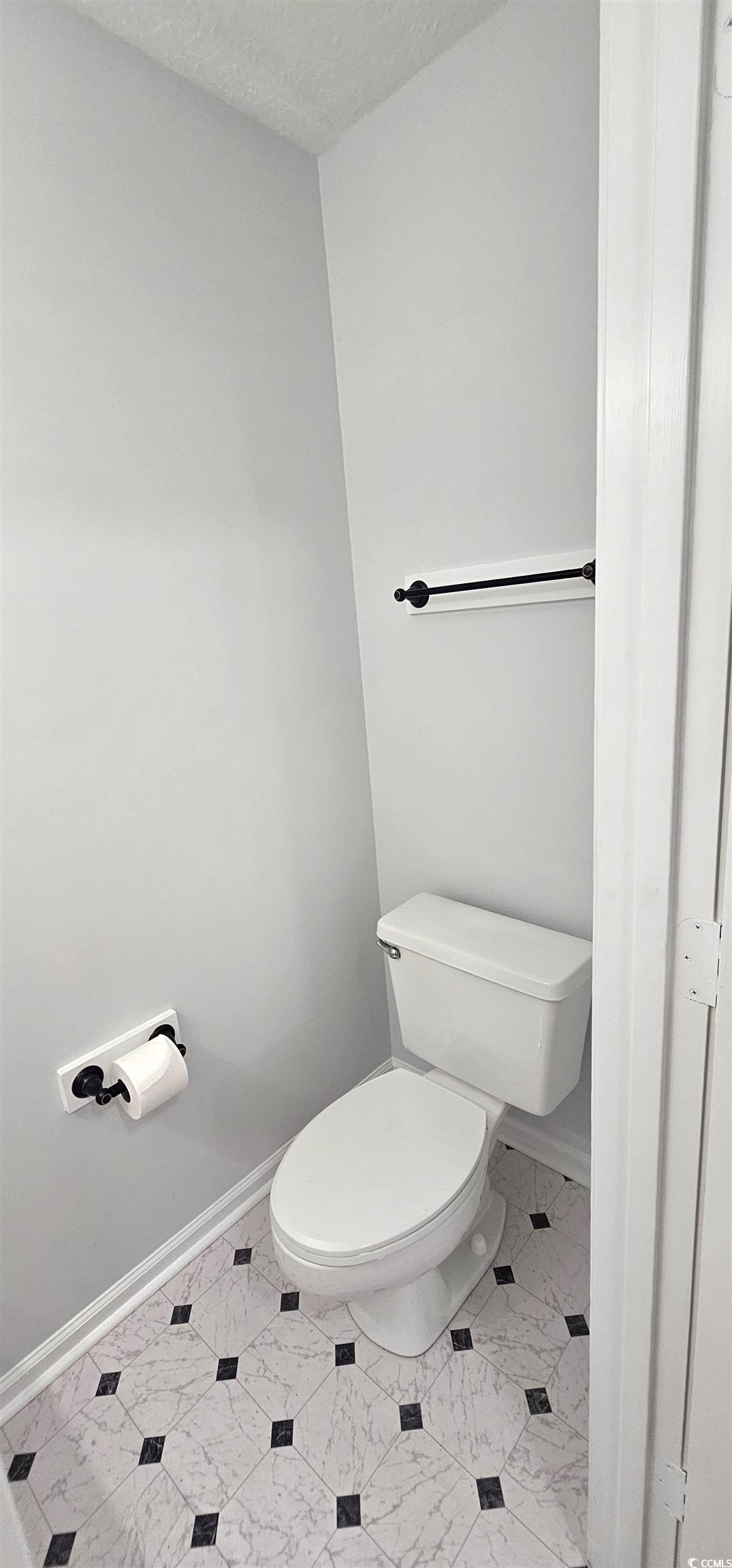 615 13th Avenue South, Unit 137 Surfside Beach, SC 29575 - Photo 15 of 40 Bathroom with a textured ceiling and baseboards
