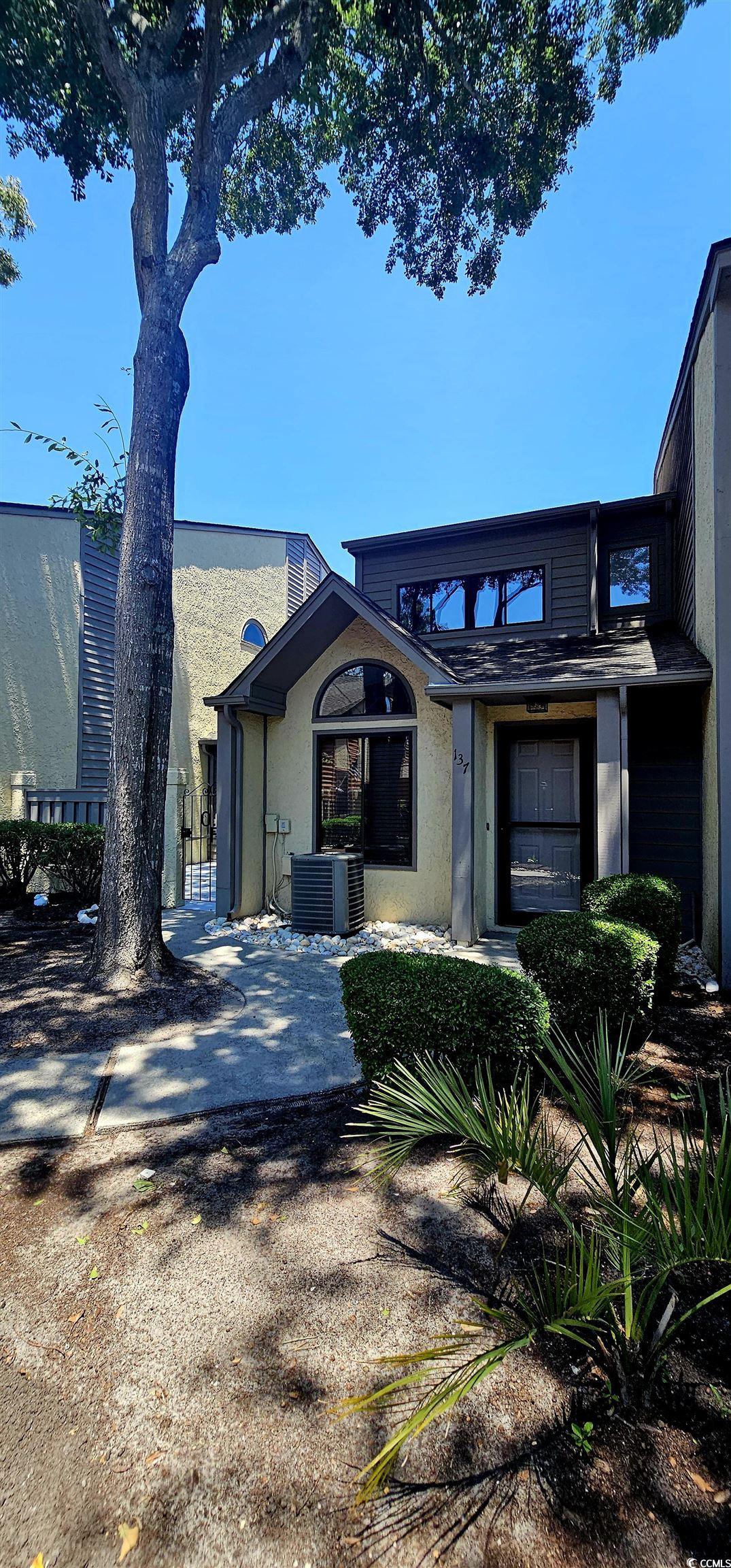 615 13th Avenue South, Unit 137 Surfside Beach, SC 29575 - Photo 2 of 40 View of front of house featuring stucco siding