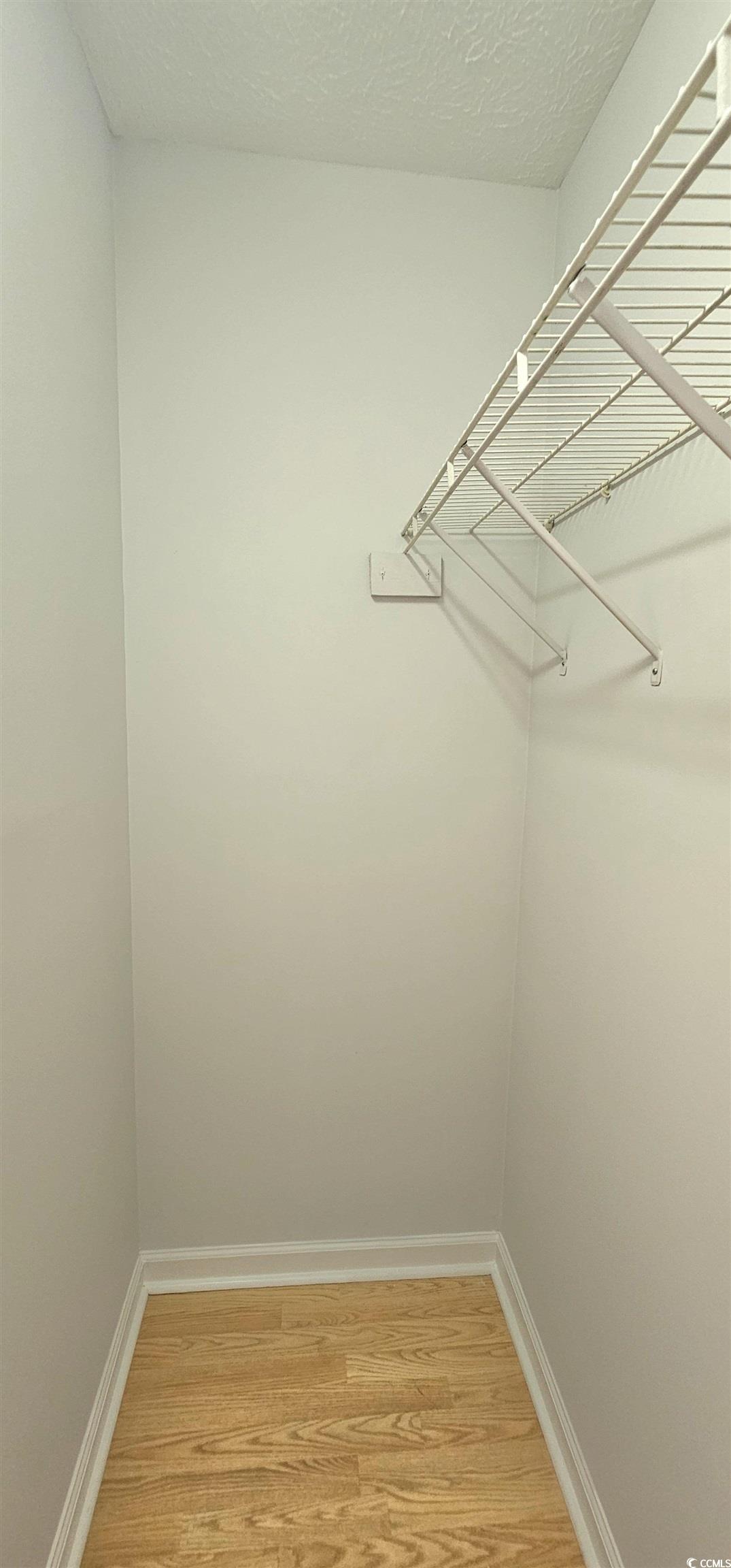 615 13th Avenue South, Unit 137 Surfside Beach, SC 29575 - Photo 21 of 40 Spacious closet featuring light wood finished floors