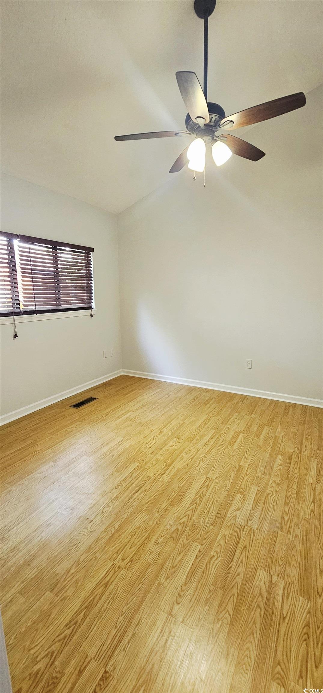 615 13th Avenue South, Unit 137 Surfside Beach, SC 29575 - Photo 25 of 40 Spare room featuring light wood-style flooring and a ceiling fan