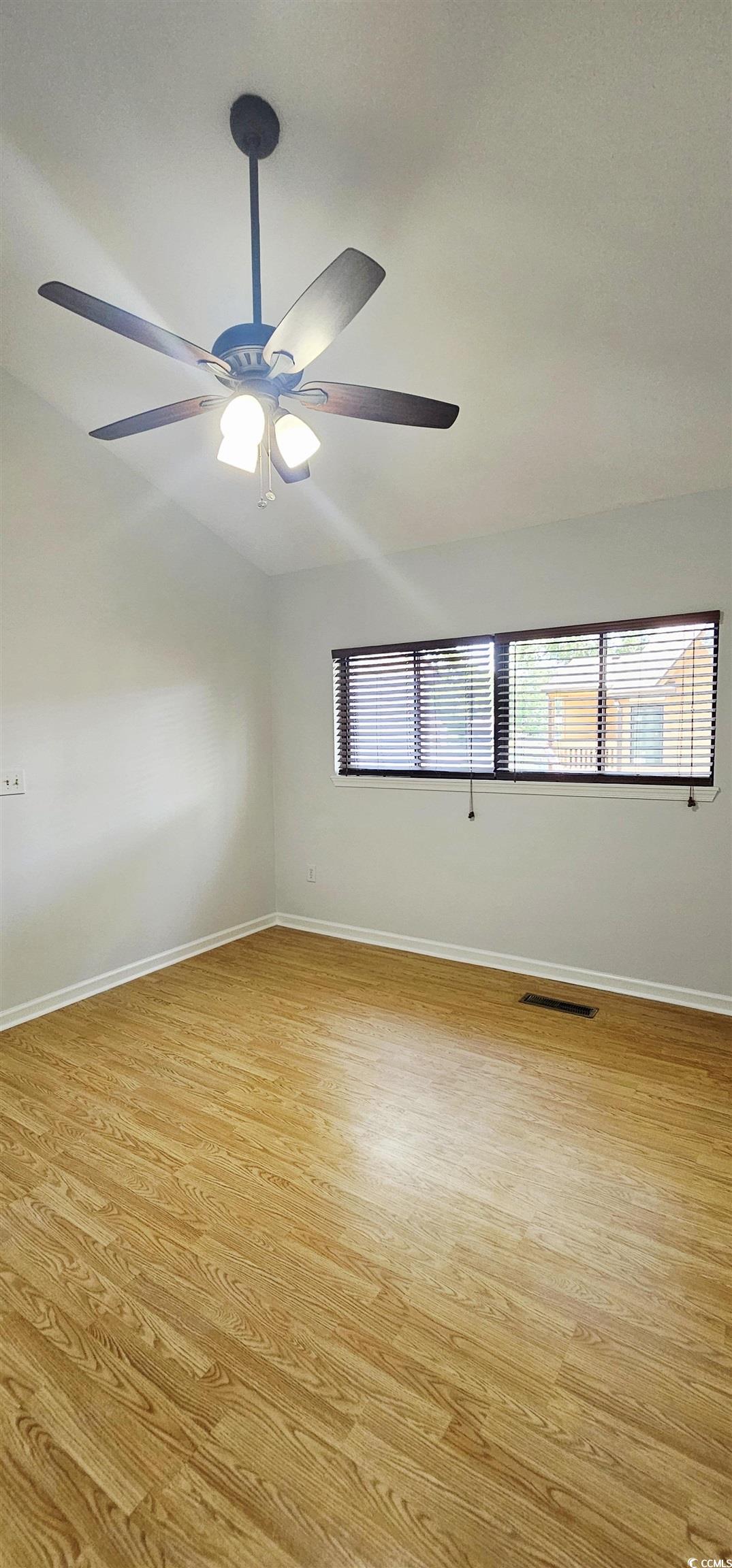 615 13th Avenue South, Unit 137 Surfside Beach, SC 29575 - Photo 26 of 40 Unfurnished room featuring light wood finished floors and ceiling fan