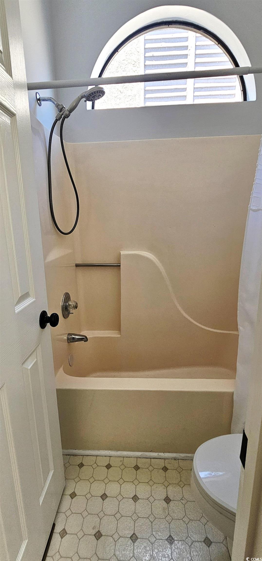 615 13th Avenue South, Unit 137 Surfside Beach, SC 29575 - Photo 29 of 40 Full bath featuring shower / tub combo with curtain and toilet