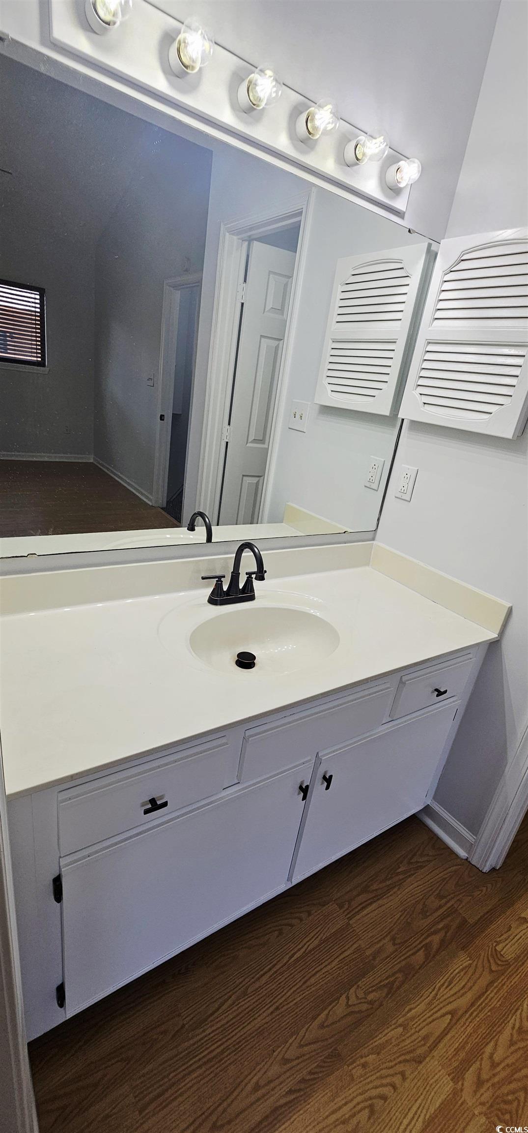 615 13th Avenue South, Unit 137 Surfside Beach, SC 29575 - Photo 31 of 40 Bathroom with dark wood finished floors and vanity