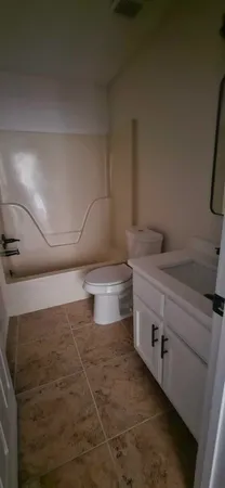 a storage room with water heater and racks