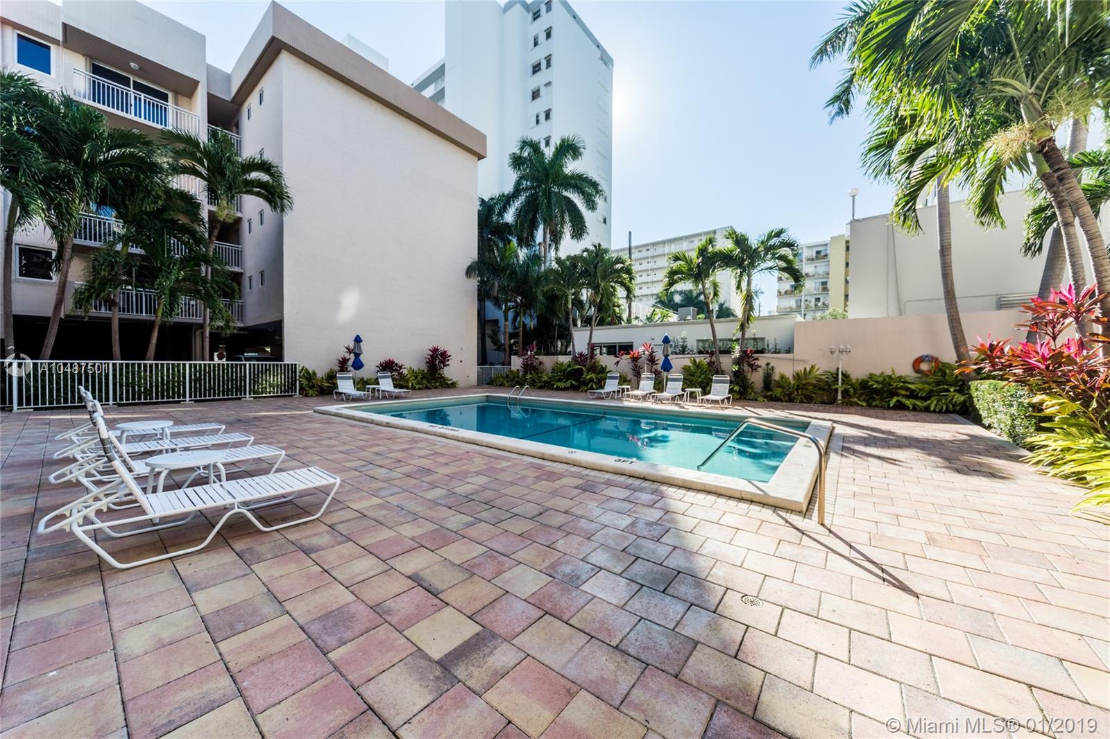 1665 Bay Road, Unit 221 Miami Beach, FL 33139 - Photo 2 of 20 Pool and lounge area with open as well as covered sections.
