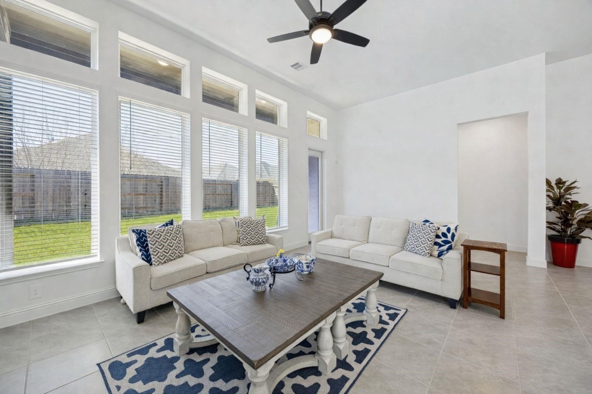 16022 Tangled Vine Lane Conroe, TX 77302 - Photo 13 of 30 a living room with furniture and a large window