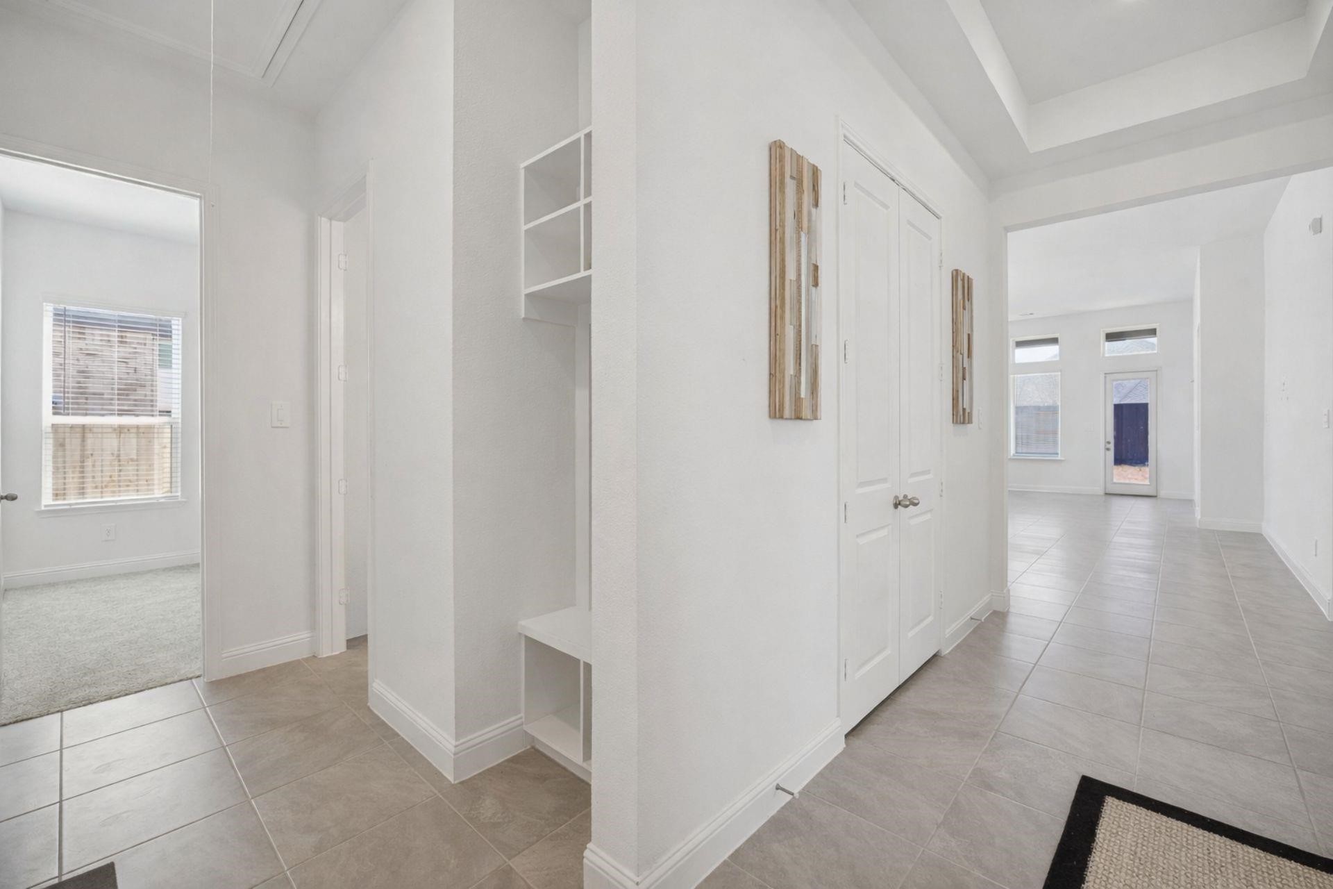 16022 Tangled Vine Lane Conroe, TX 77302 - Photo 14 of 30 a view of a hallway with wooden floor and closet area