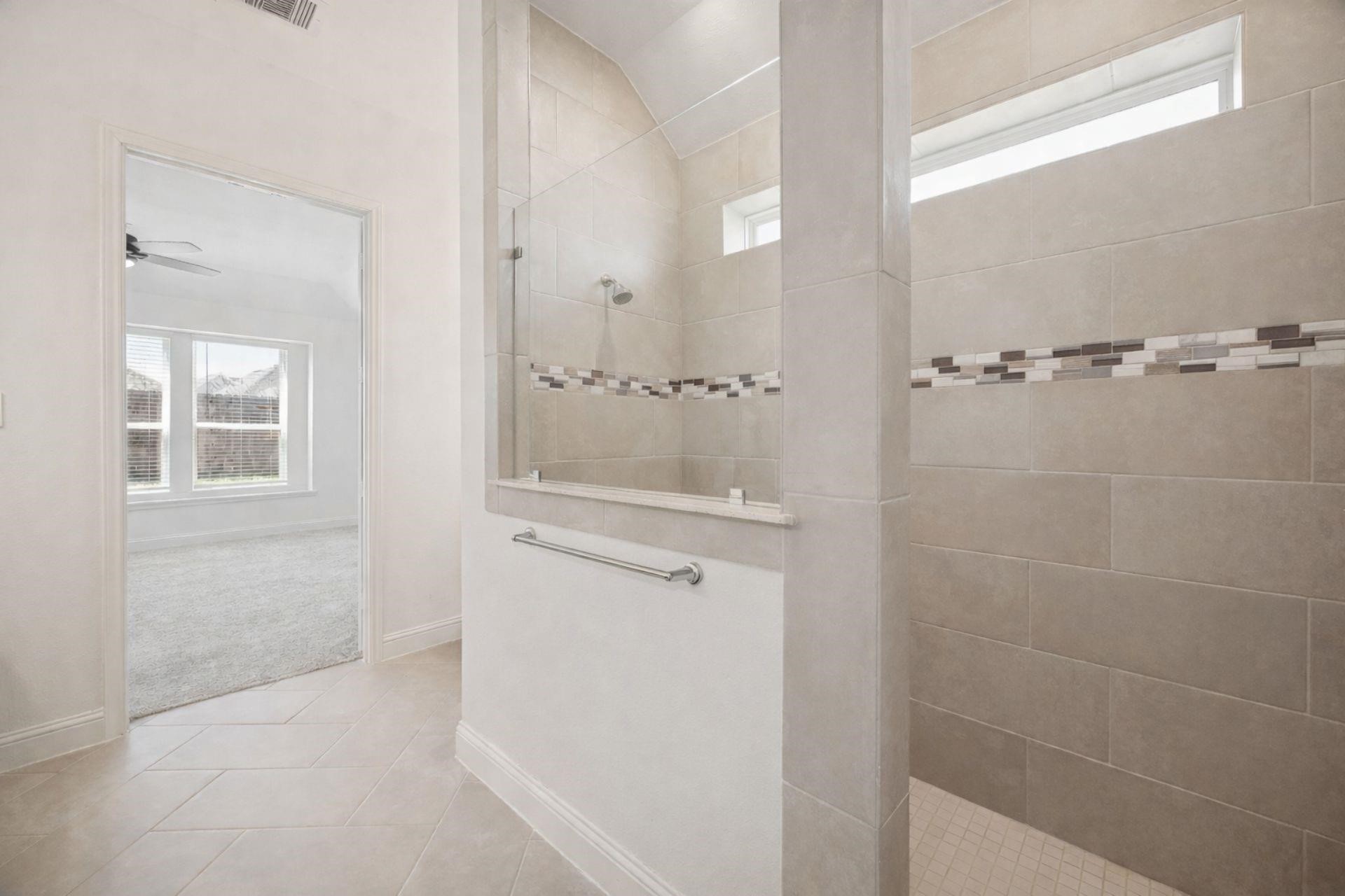16022 Tangled Vine Lane Conroe, TX 77302 - Photo 17 of 30 a bathroom with a shower