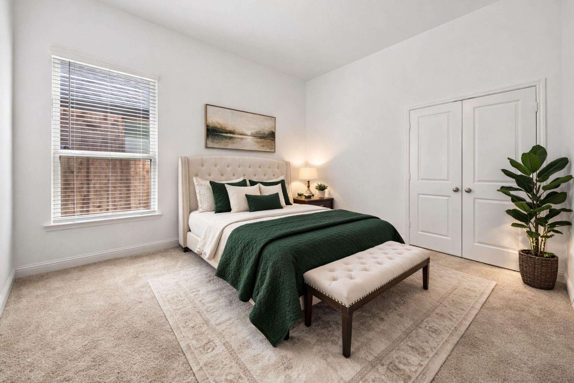 16022 Tangled Vine Lane Conroe, TX 77302 - Photo 20 of 30 a bedroom with a large bed and a potted plant