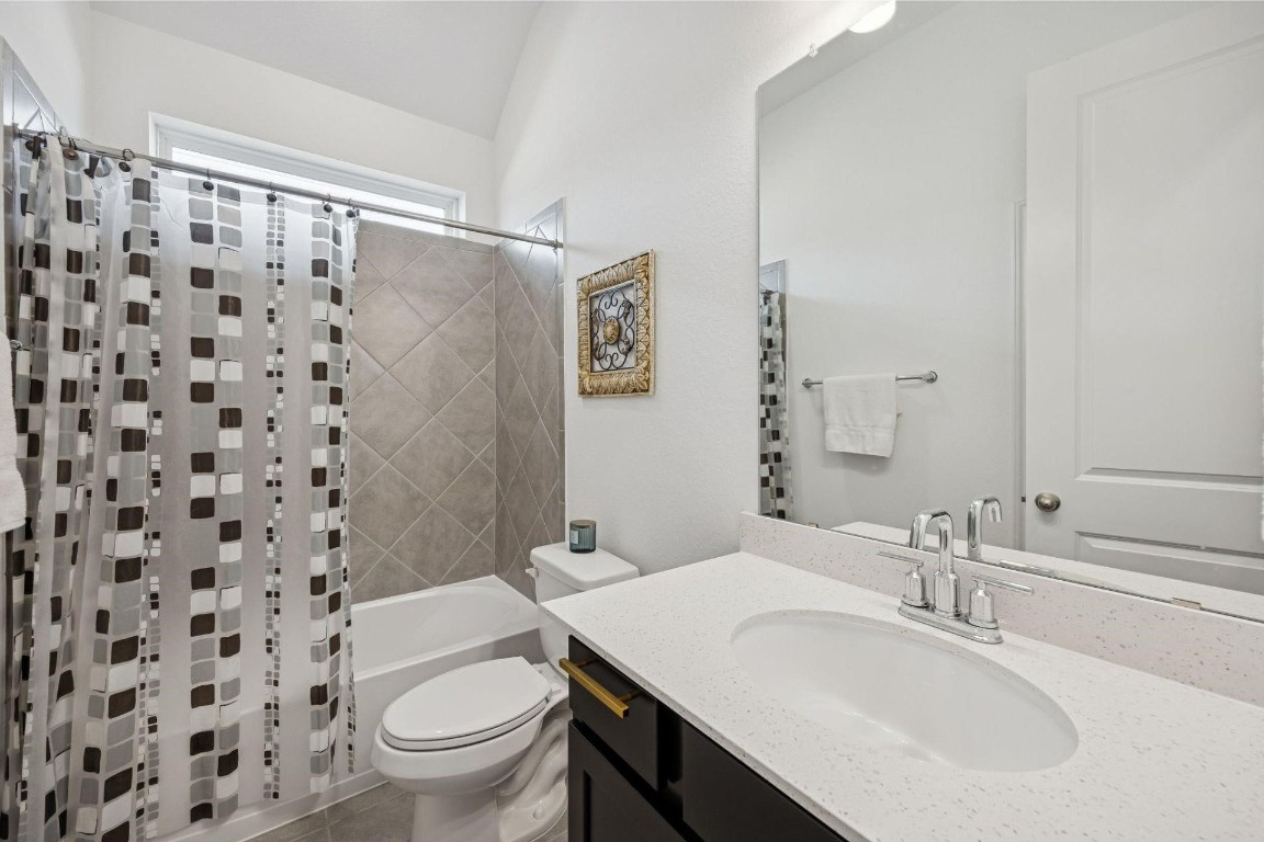 16022 Tangled Vine Lane Conroe, TX 77302 - Photo 21 of 30 a bathroom with a sink toilet and shower