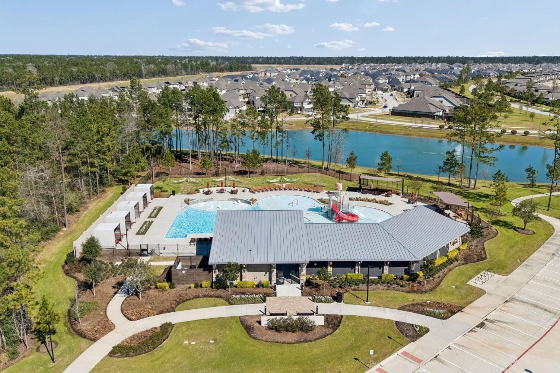 16022 Tangled Vine Lane Conroe, TX 77302 - Photo 26 of 30 a aerial view of a house with swimming pool and outdoor seating