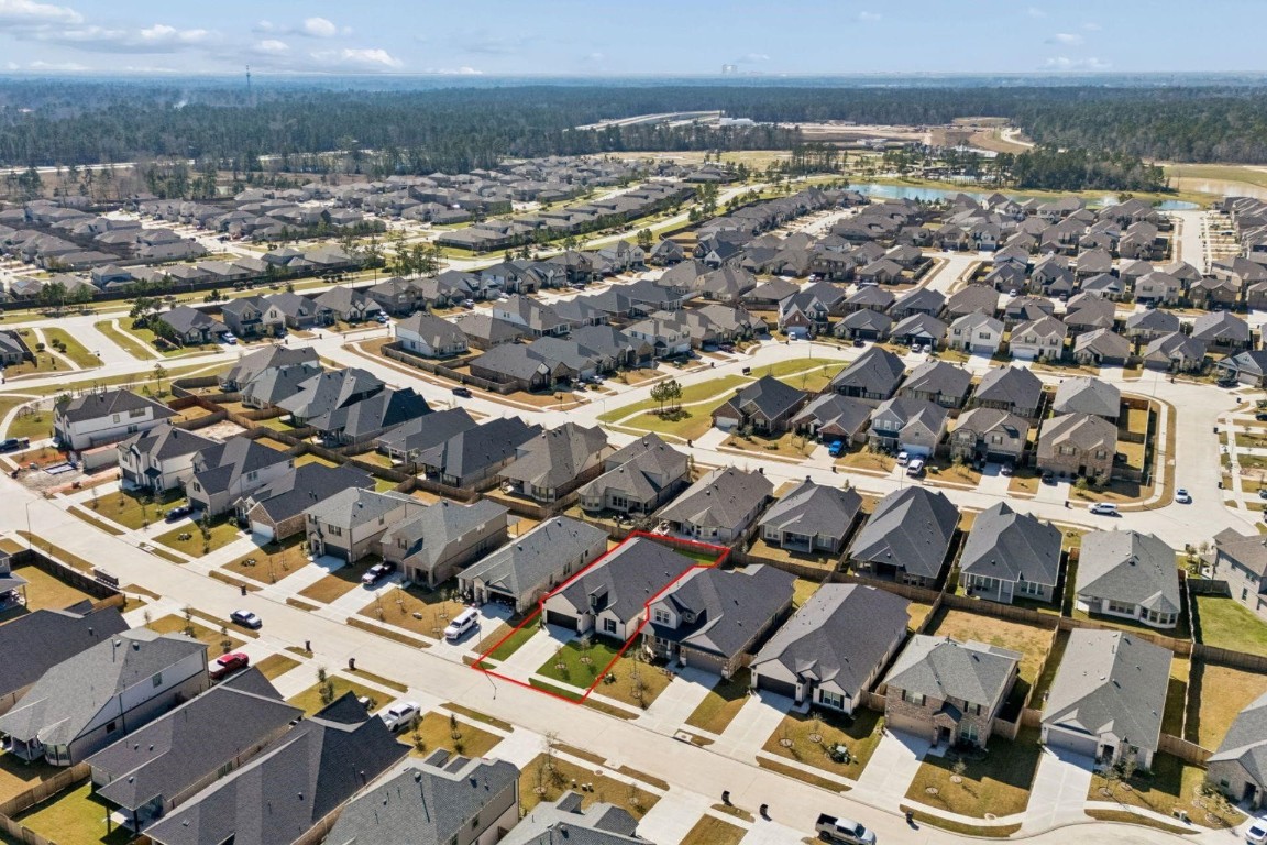 16022 Tangled Vine Lane Conroe, TX 77302 - Photo 27 of 30 an aerial view of a city