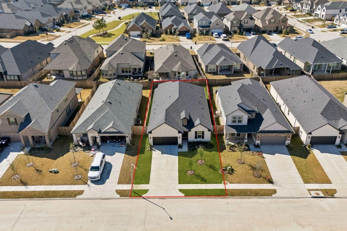 16022 Tangled Vine Lane Conroe, TX 77302 - Photo 29 of 30 an aerial view of residential houses with outdoor space