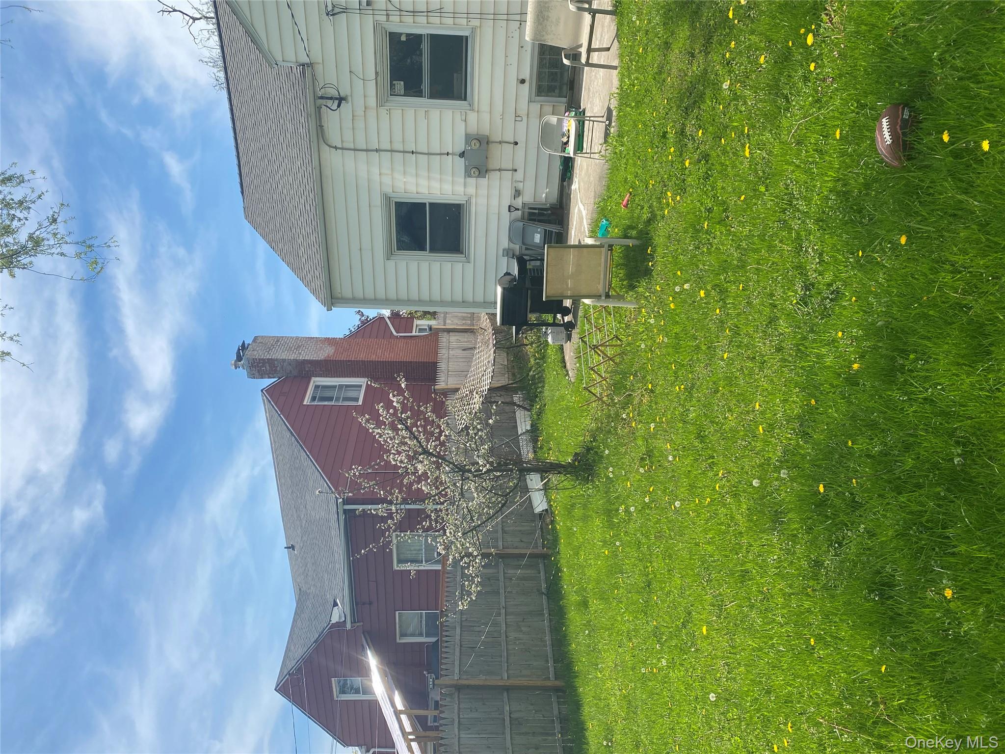 321 Niagara Falls Boulevard Buffalo, NY 14226 - Photo 11 of 13 a backyard of a house with table and chairs