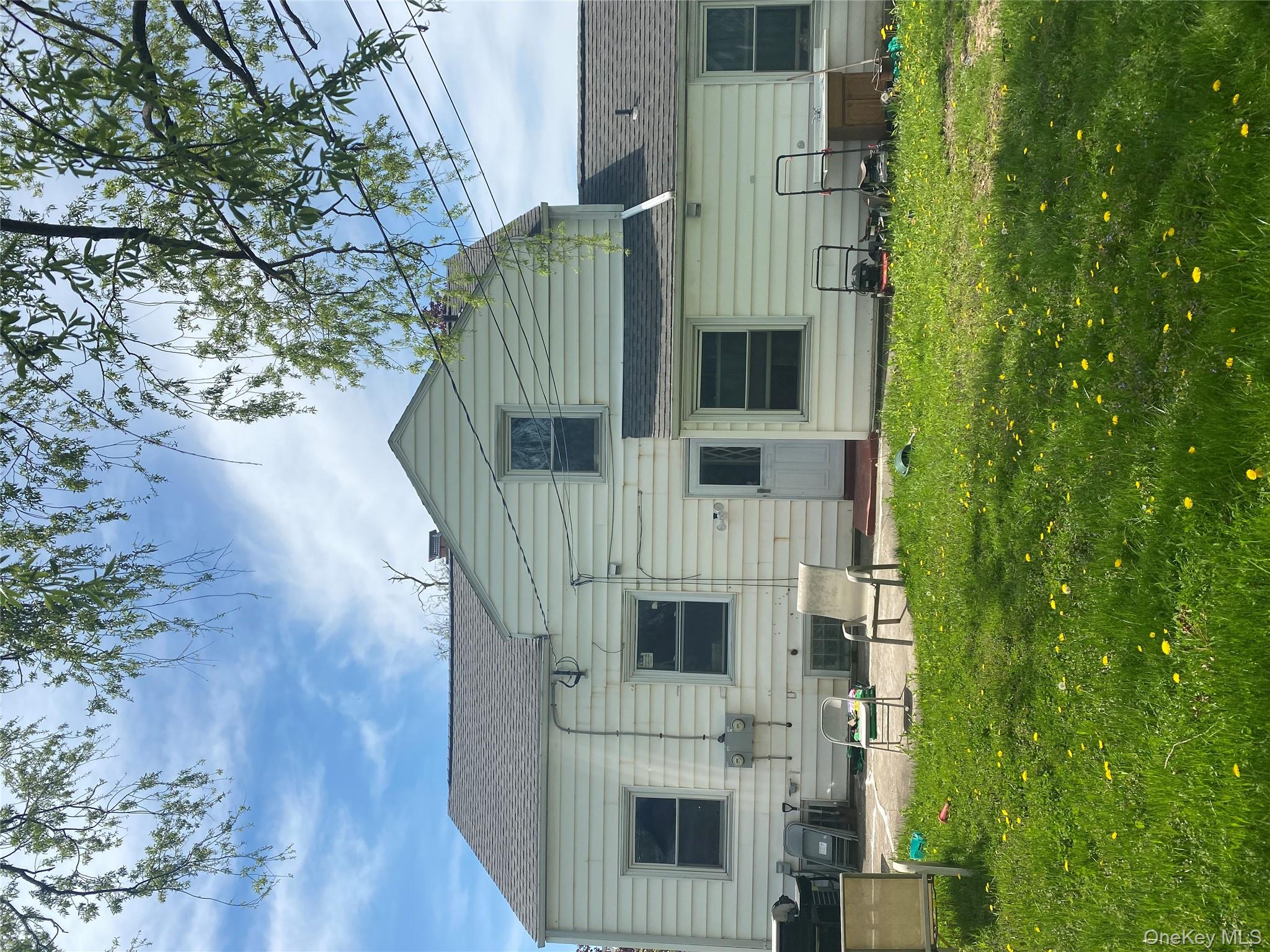 321 Niagara Falls Boulevard Buffalo, NY 14226 - Photo 12 of 13 a front view of house with yard and outdoor seating