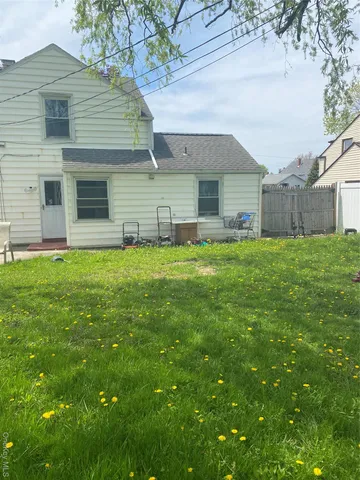 a view of a house with a yard and garage
