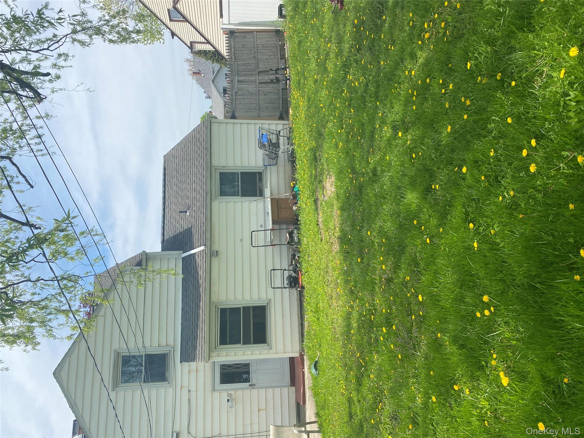 321 Niagara Falls Boulevard Buffalo, NY 14226 - Photo 13 of 13 a view of a house with a yard and garage