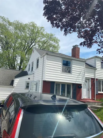 a front view of a house with swimming pool