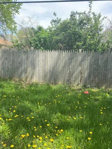 a backyard of a house with lots of green space