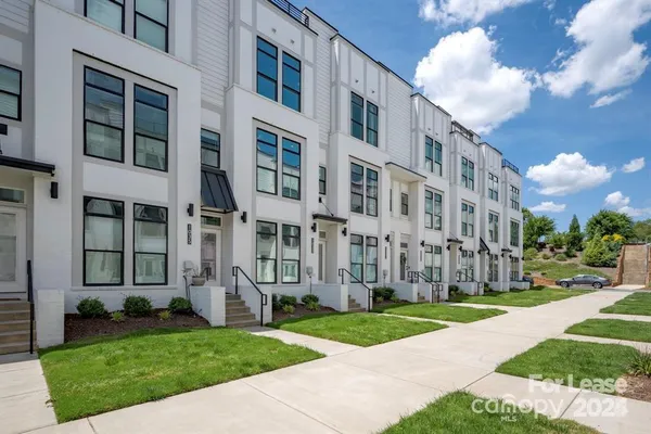 a view of a building with a yard