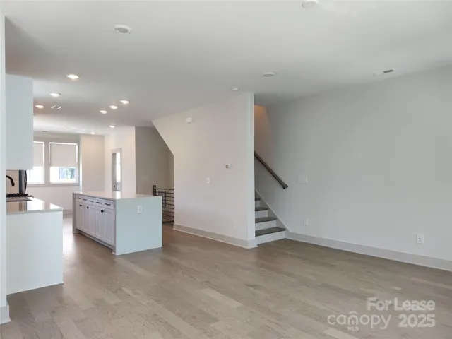 a view of an empty room with a fireplace