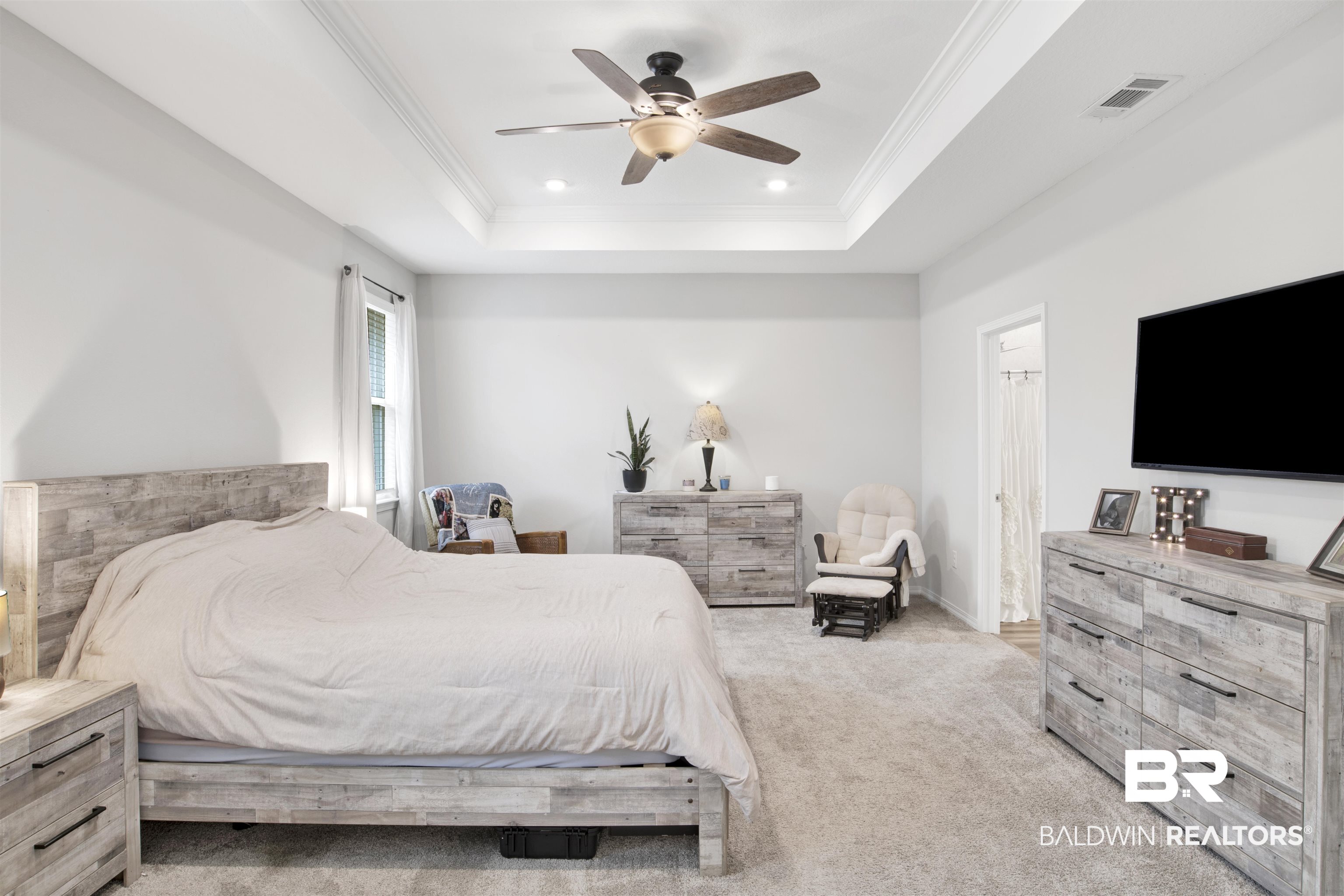 1742 Versant Loop Foley, AL 36535 - Photo 14 of 23 Bedroom featuring crown molding, light colored carpet, a raised ceiling, and ceiling fan