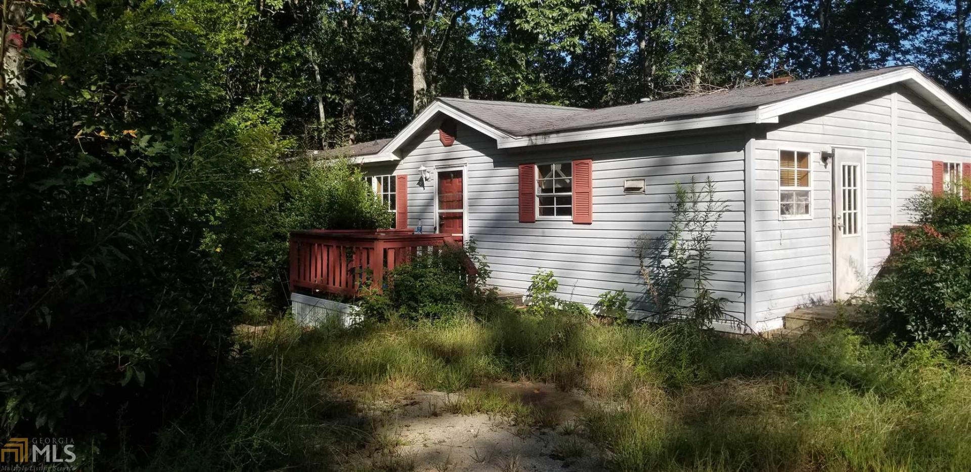 48 Triple Tree Road Bremen, GA 30110 - Photo 1 of 1 a view of a yard in front of house