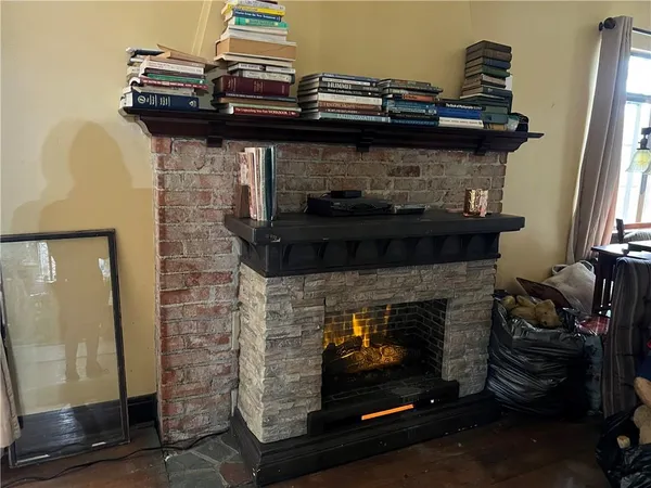 a stove top oven sitting inside of a kitchen