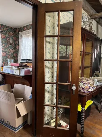 a dining room with furniture and a window
