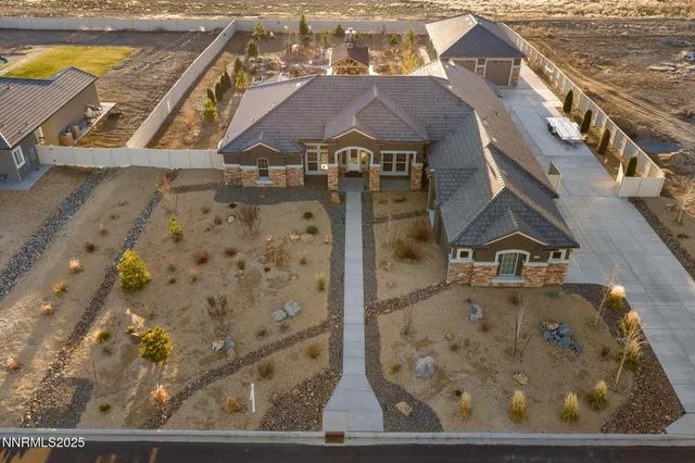 a kitchen with stainless steel appliances wooden cabinets a sink and a stove