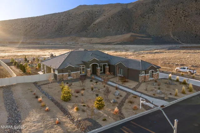 a living room with furniture a flat screen tv and a window