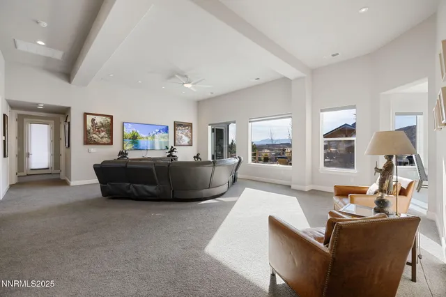a view of a patio with table and chairs under an umbrella with wooden floor