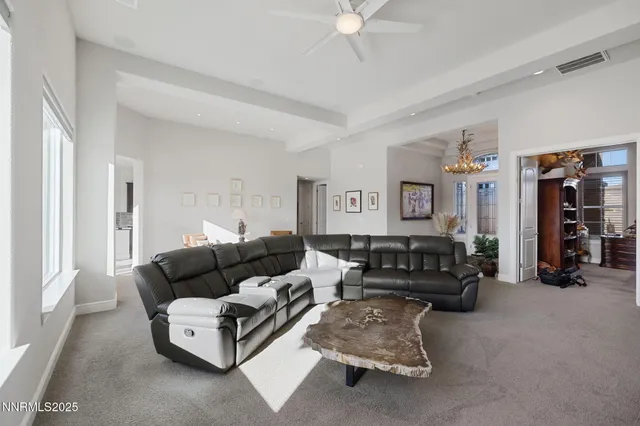 a view of a patio with table and chairs and potted plants