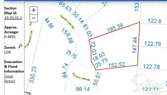 a view of a yard with a tree