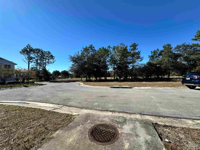 a view of a patio with a table chairs and a backyard