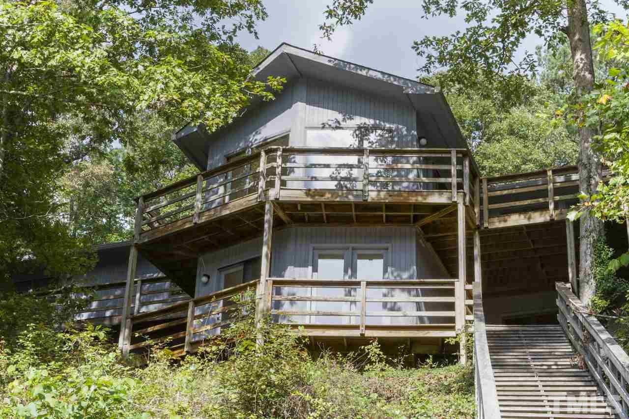 1600 Center Grove Church Road Moncure, NC 27559 - Photo 2 of 25 Spectacular Views from Almost Every Room! This home offers high quality windows and cedar siding that was recently painted. Natural gas heat, Updated gas hot water heater, central vacuum, & security system.