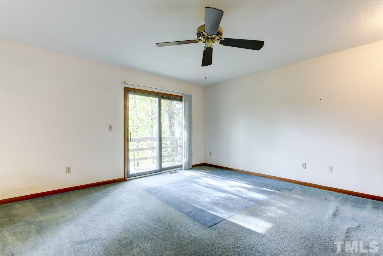 1600 Center Grove Church Road Moncure, NC 27559 - Photo 18 of 25 Large Master Suite with beautiful river views and deck access. Private Bath & Walk in closet. Needs new carpet - Home needs cosmetic updating.