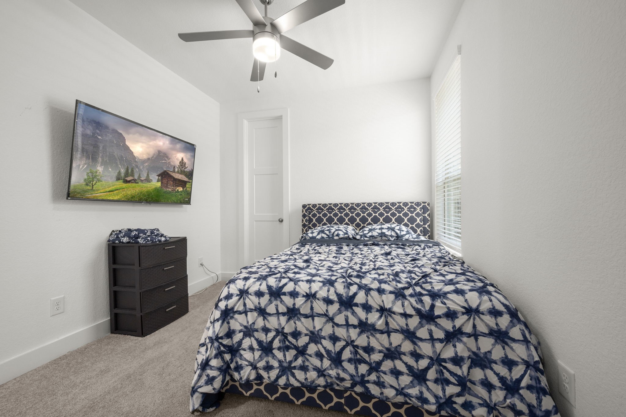 13035 Wandering Rdg Lane Conroe, TX 77302 - Photo 20 of 28 a bedroom with a bed and a black furniture