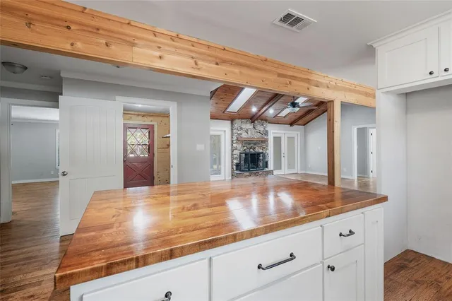 a view of kitchen with cabinets