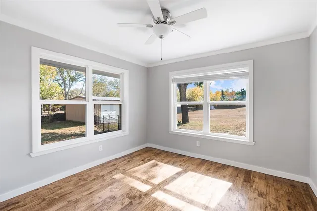 a view of an empty room with a window