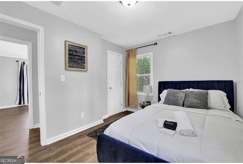 3162 Oakdale Road Hapeville, GA 30354 - Photo 26 of 26 a bedroom with a bed and a window