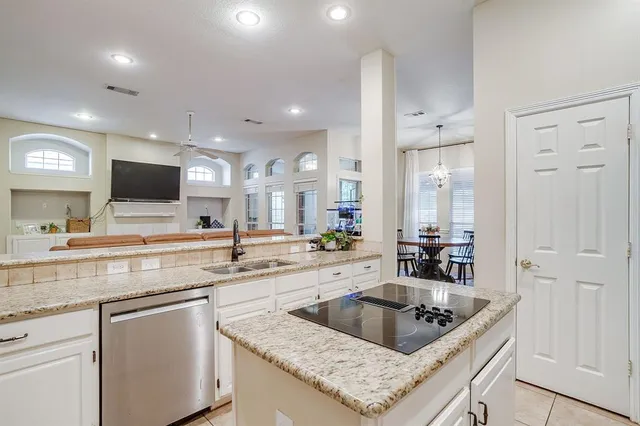 a kitchen with a sink a counter and cabinets
