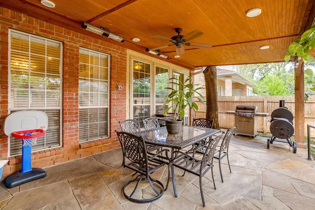 a view of a livingroom with furniture and a porch