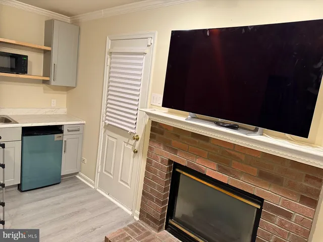 a stove top oven sitting inside of a kitchen