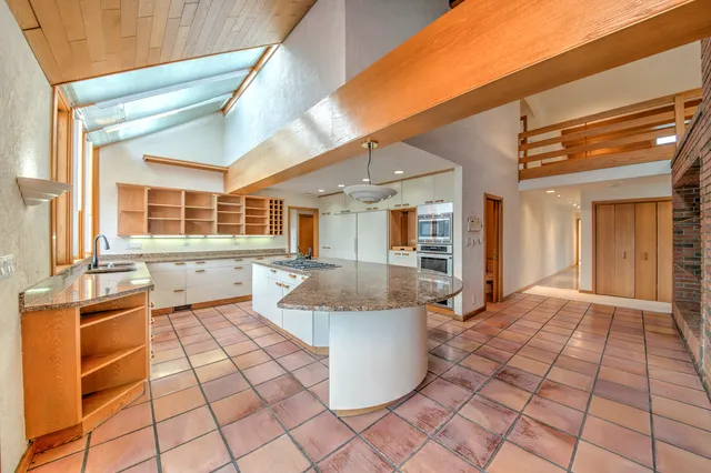 a kitchen with a sink stove and cabinets