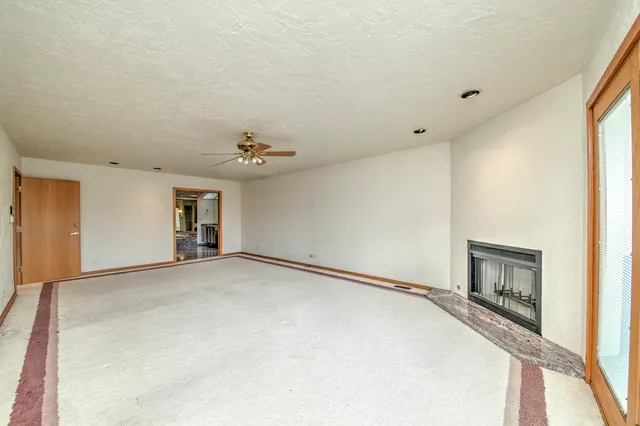 a lobby with furniture and large window
