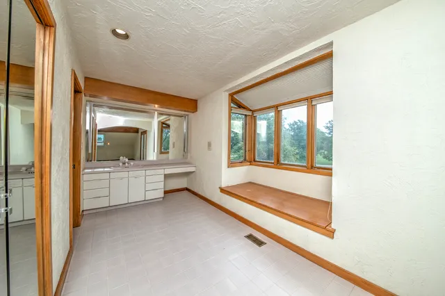 a view of empty room with windows