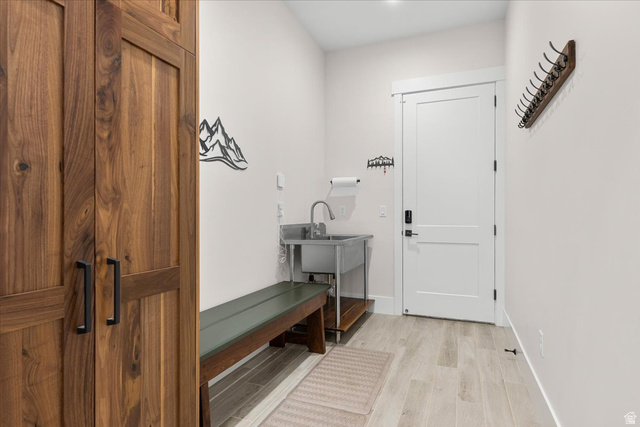 1210 East Bristle Cone Road Pine Valley, UT 84781 - Photo 21 of 54 Mudroom area featuring light wood-like tile flooring, bench, sink, and storage