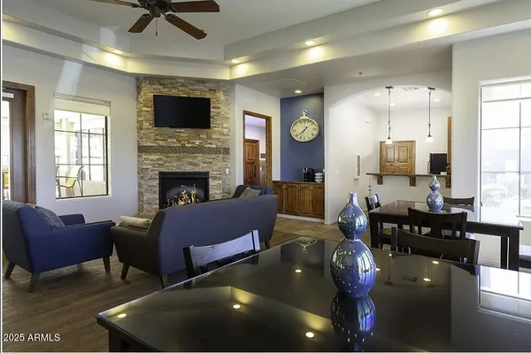 a living room with furniture fireplace and a flat screen tv